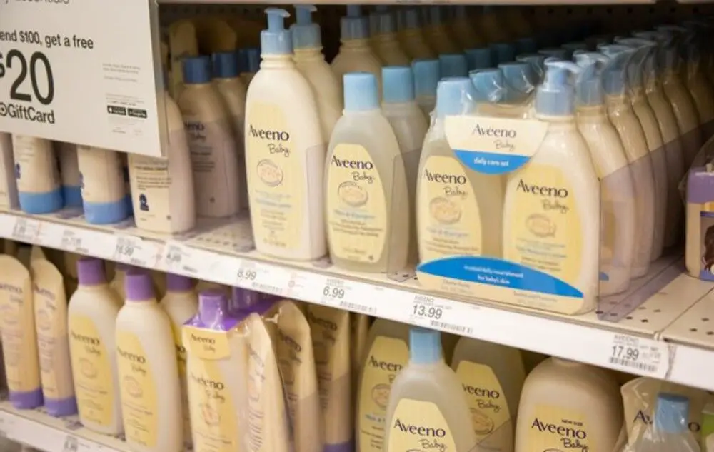 Aveeno baby shampoo bottles on a shelf