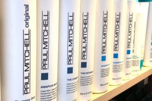 Multiple Paul Mitchell shampoos for pets on a store shelf